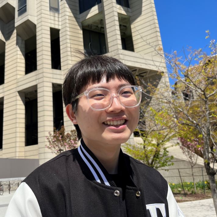 Alex Park standing in front of Robarts Library on a sunny day