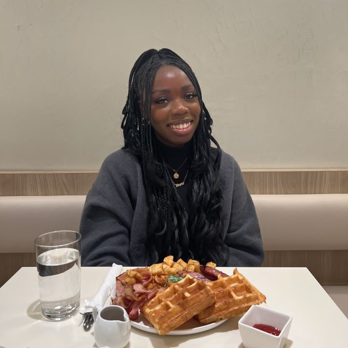 Doyan pictured at a restaurant with food on the table