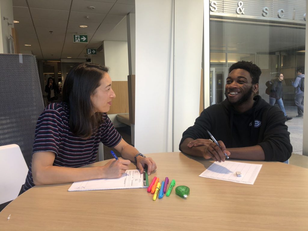 A learning strategist meeting with the student in the Sidney Smith Commons